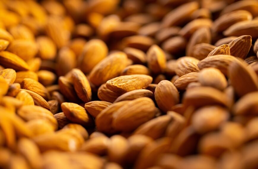 Detailed close-up of brown raw almonds showcasing texture and natural appearance.